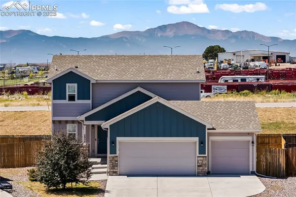 a aerial view of a house with a yard