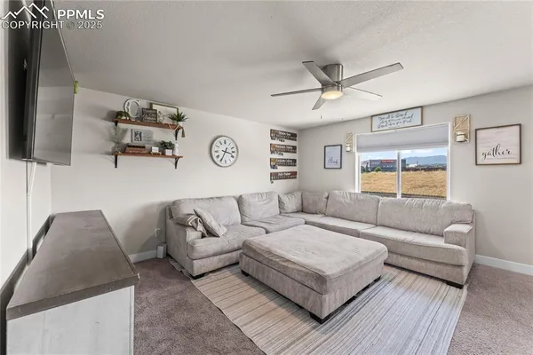 a living room with furniture and a window