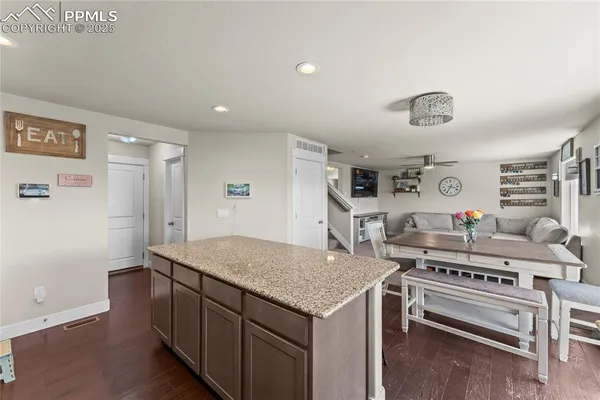 a kitchen with a stove and a refrigerator