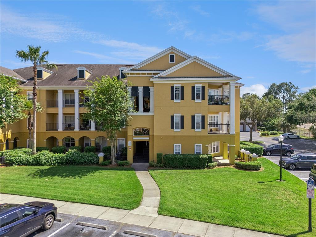 3751 Conroy Road, Unit 2325 Orlando, FL 32839 - Photo 1 of 31 a front view of a house with a yard
