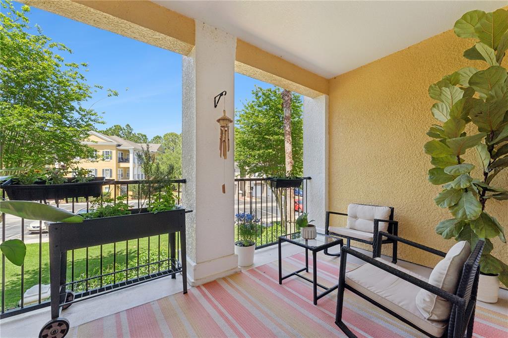 3751 Conroy Road, Unit 2325 Orlando, FL 32839 - Photo 19 of 31 a view of a balcony with furniture