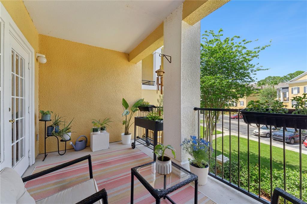 3751 Conroy Road, Unit 2325 Orlando, FL 32839 - Photo 20 of 31 a view of a balcony with chairs