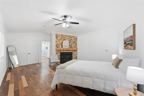 a bed room with a bed and a fireplace