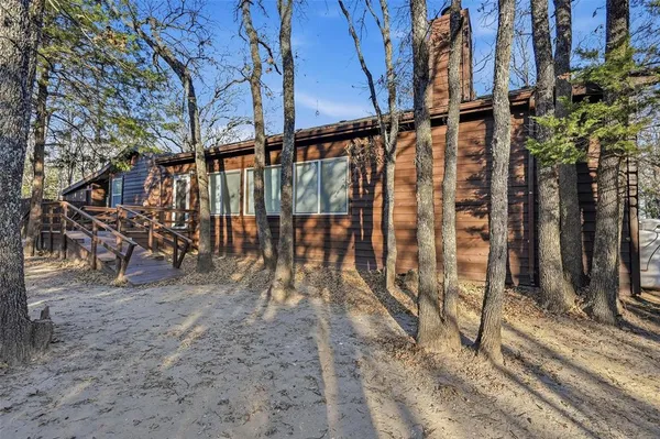 a view of a yard with a tree