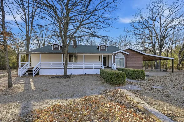 a kitchen with sink cabinets and window