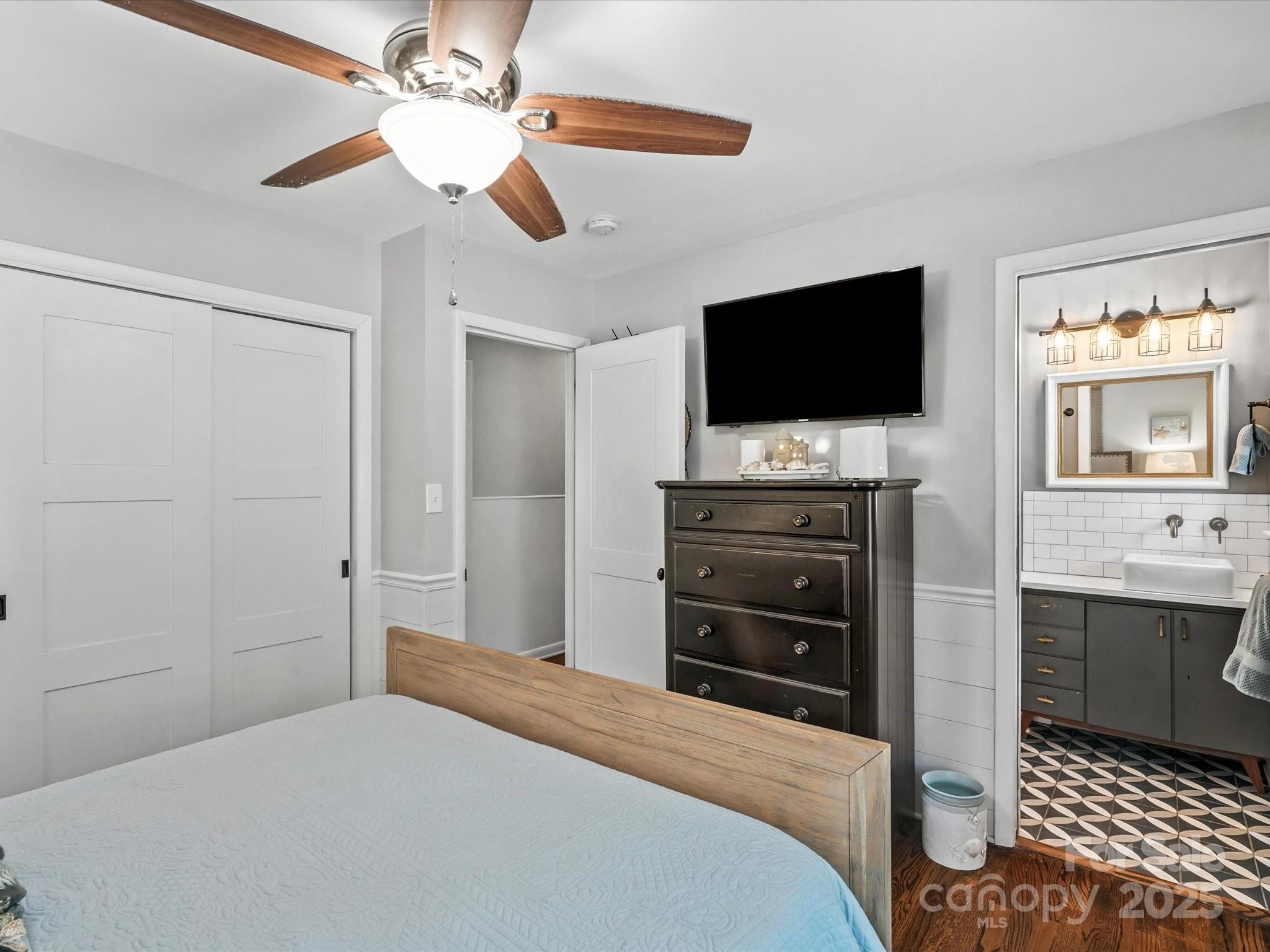 102 Ridge Avenue Clover, SC 29710 - Photo 31 of 48 a bedroom with a bed and a flat screen tv