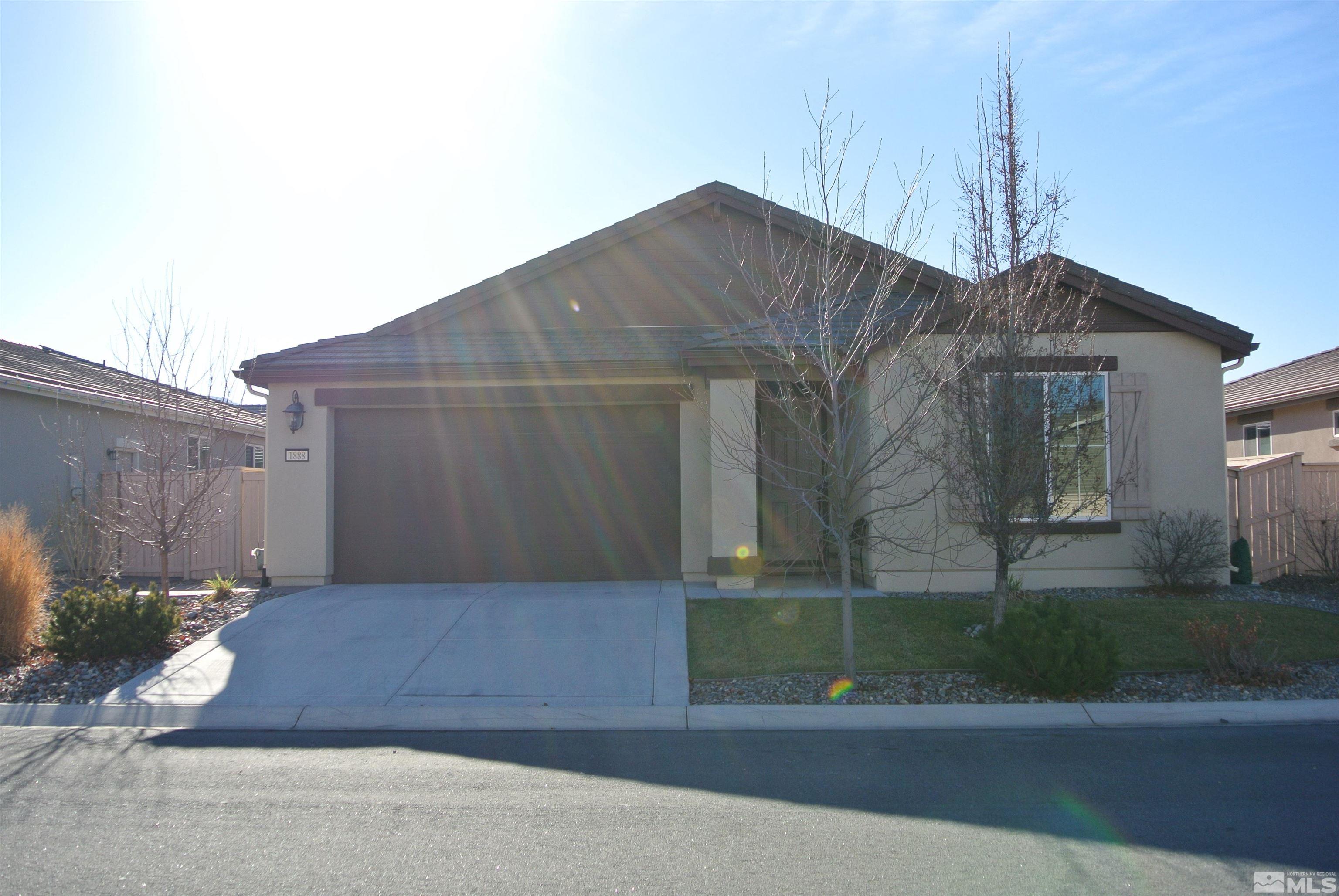 1888 Cholula Drive Reno, NV 89521 - Photo 1 of 17 a house view with a garden