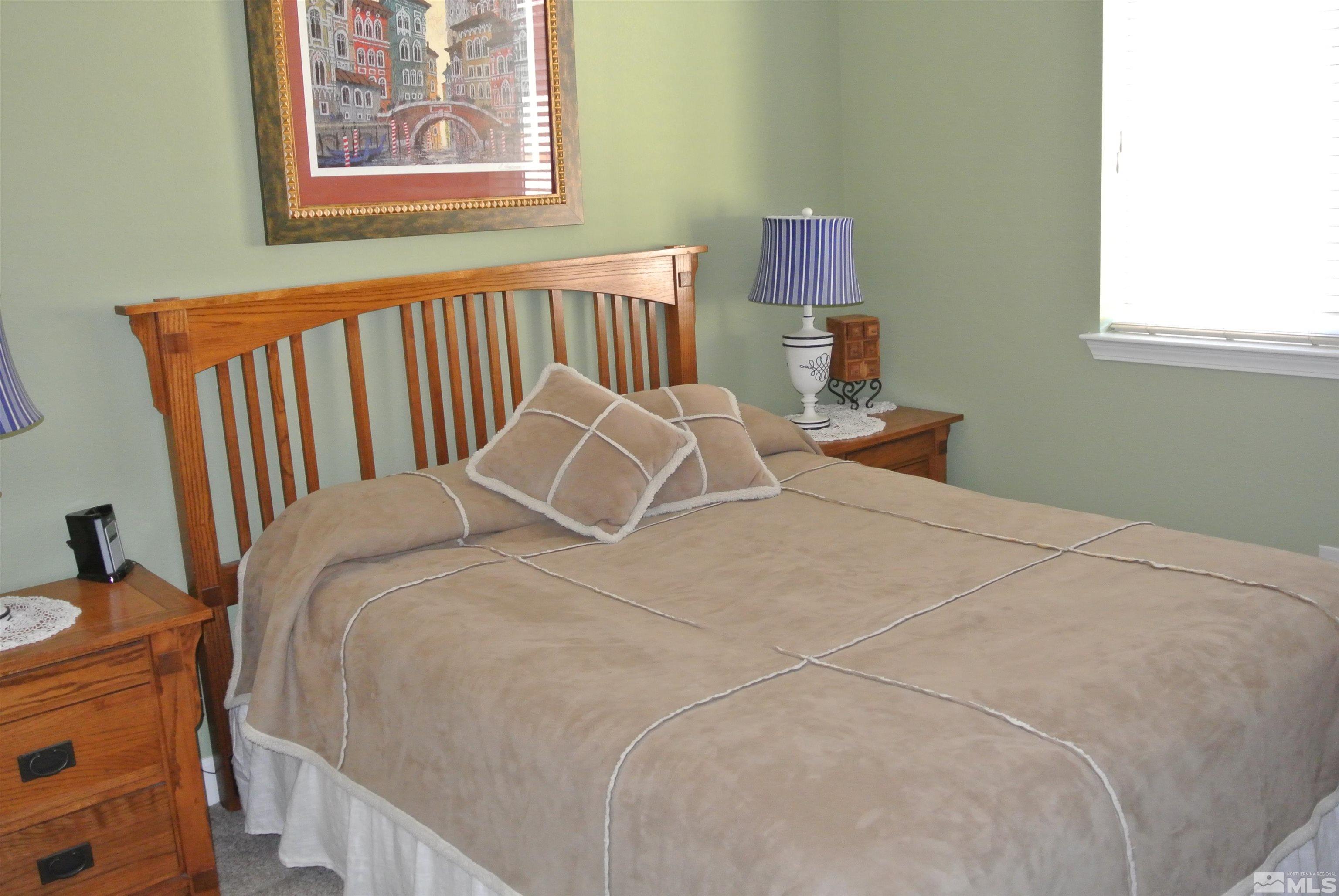 1888 Cholula Drive Reno, NV 89521 - Photo 12 of 17 a bedroom with a bed and a window