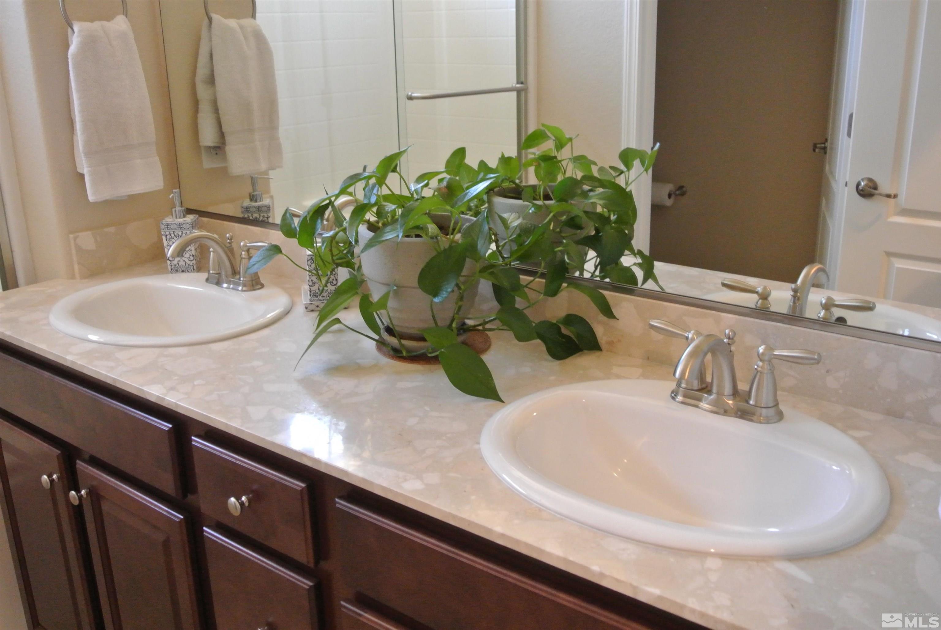 1888 Cholula Drive Reno, NV 89521 - Photo 13 of 17 a bathroom with a sink and a mirror