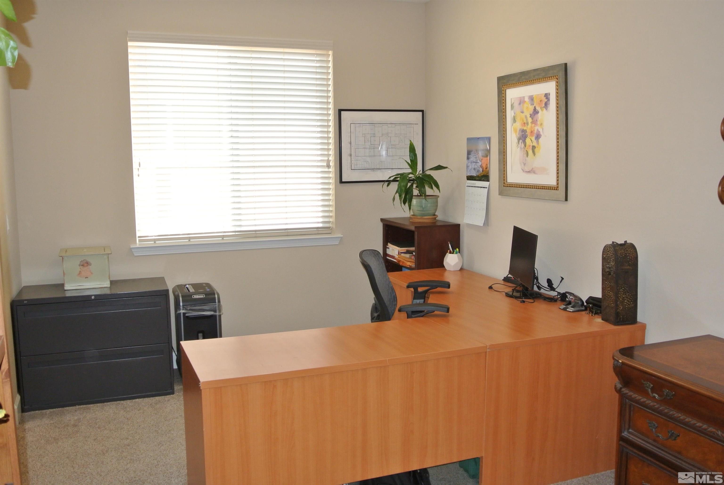 1888 Cholula Drive Reno, NV 89521 - Photo 15 of 17 a workspace with a desk and chair next to a window