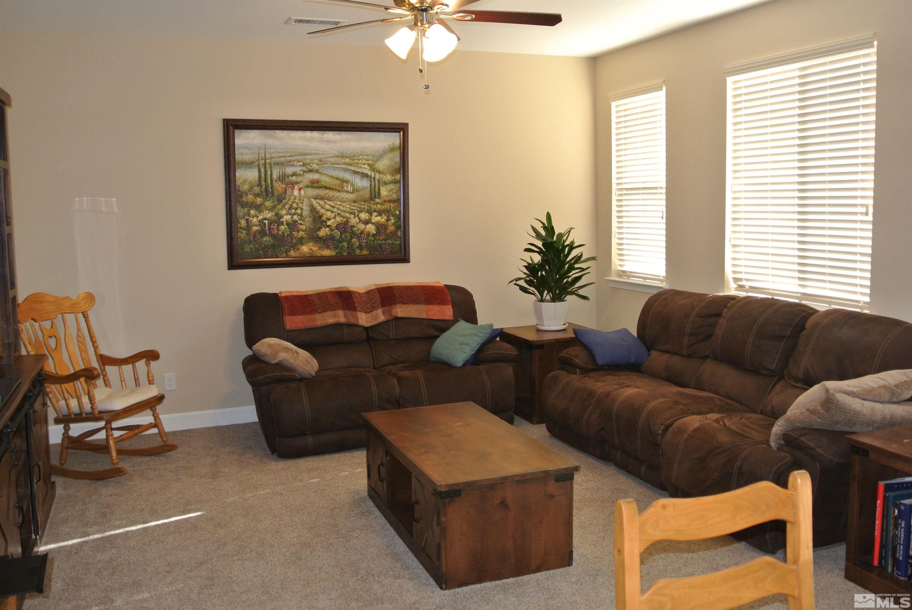 1888 Cholula Drive Reno, NV 89521 - Photo 6 of 17 a living room with furniture and a large window