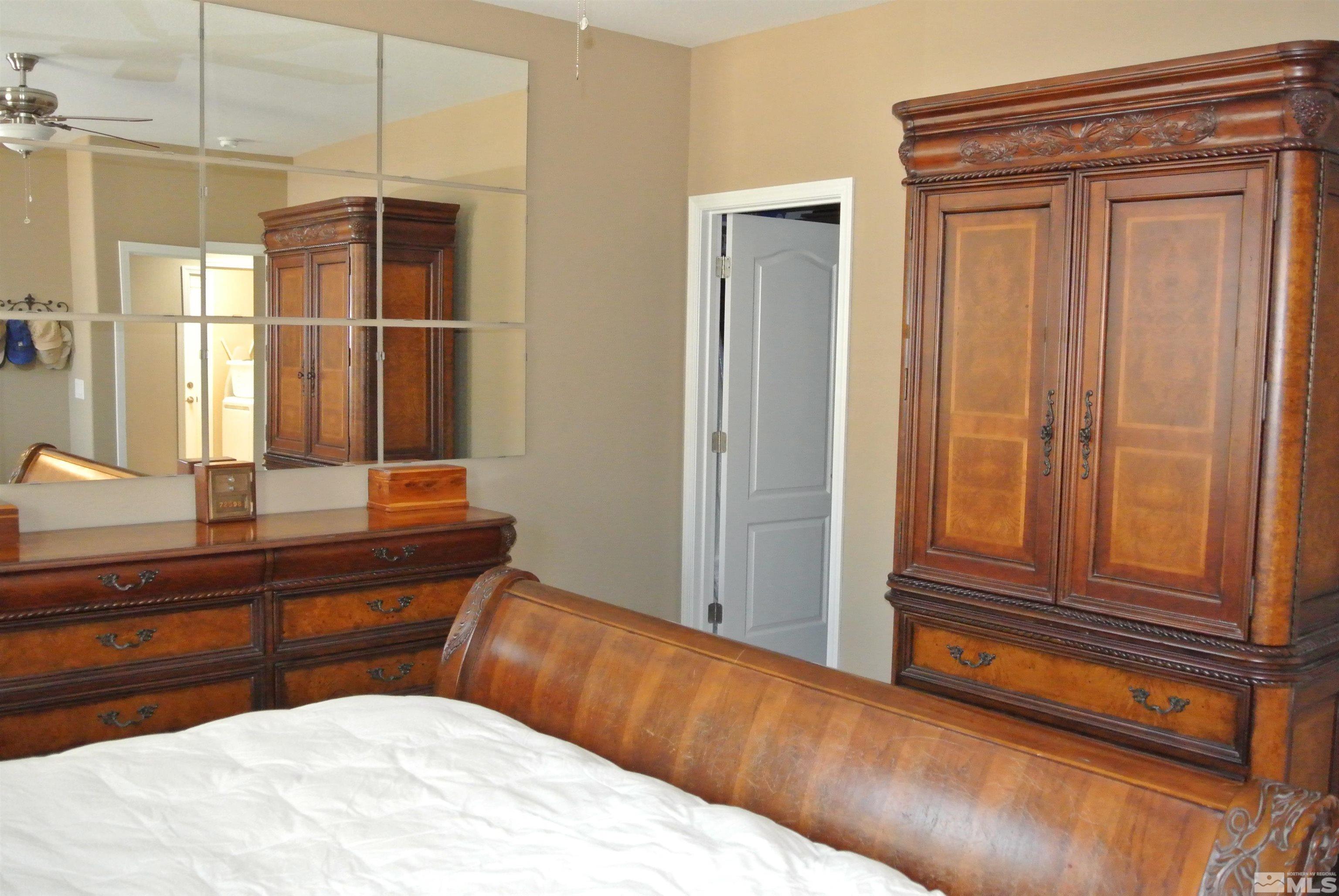 1888 Cholula Drive Reno, NV 89521 - Photo 8 of 17 a bedroom with a bed and a dresser