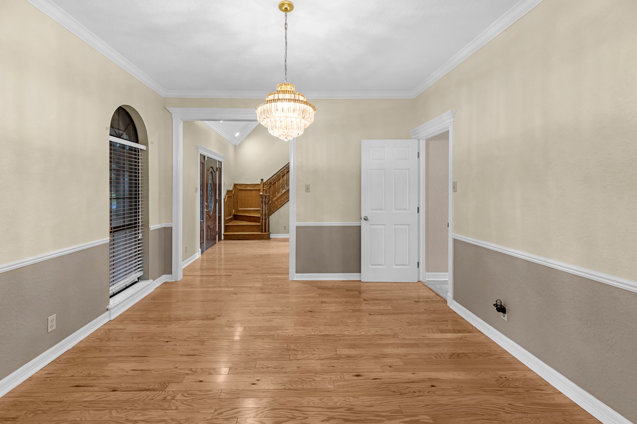 24849 County Road 48 Angleton, TX 77515 - Photo 14 of 48 a view of a hallway with a chandelier and a chandelier