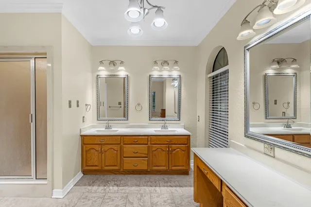 a bathroom with a tub sink and mirror