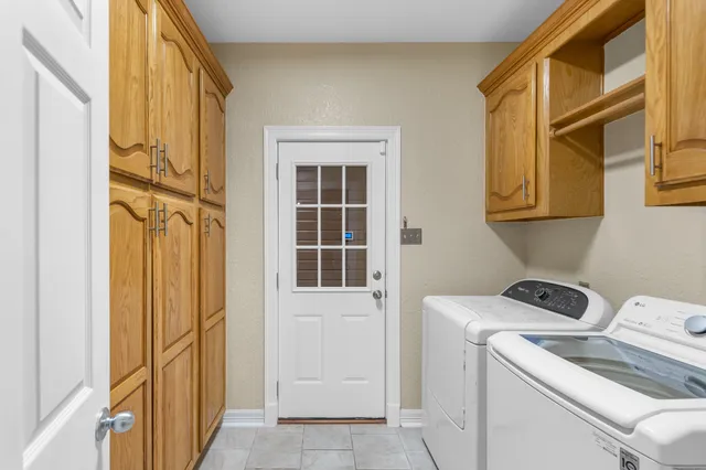 a utility room with dryer and washer