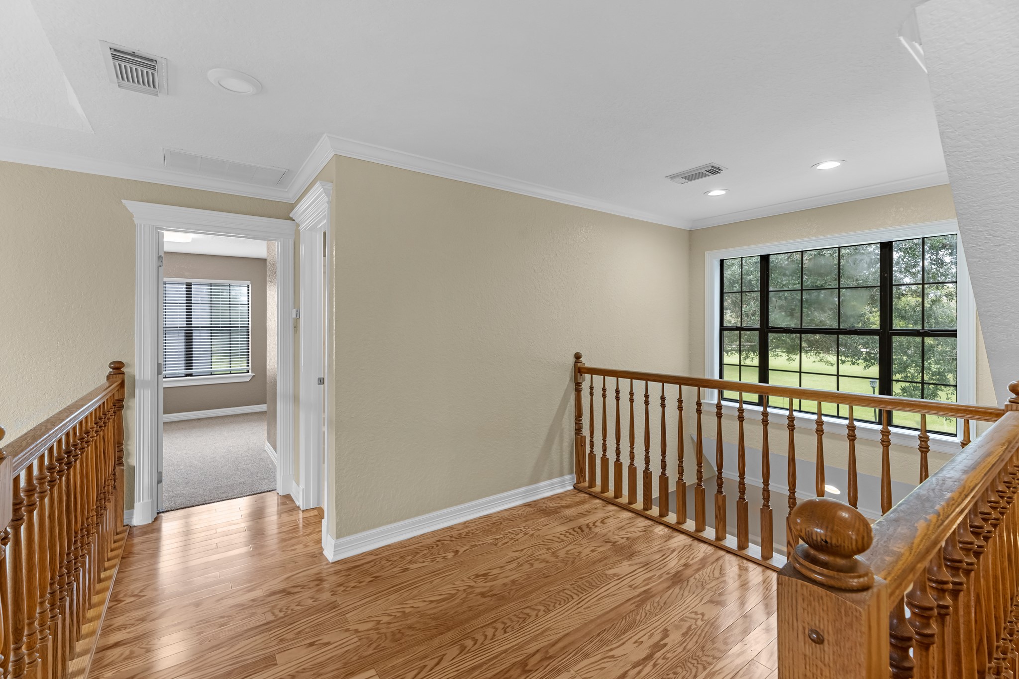 24849 County Road 48 Angleton, TX 77515 - Photo 25 of 48 a view of a hallway with wooden floor and windows