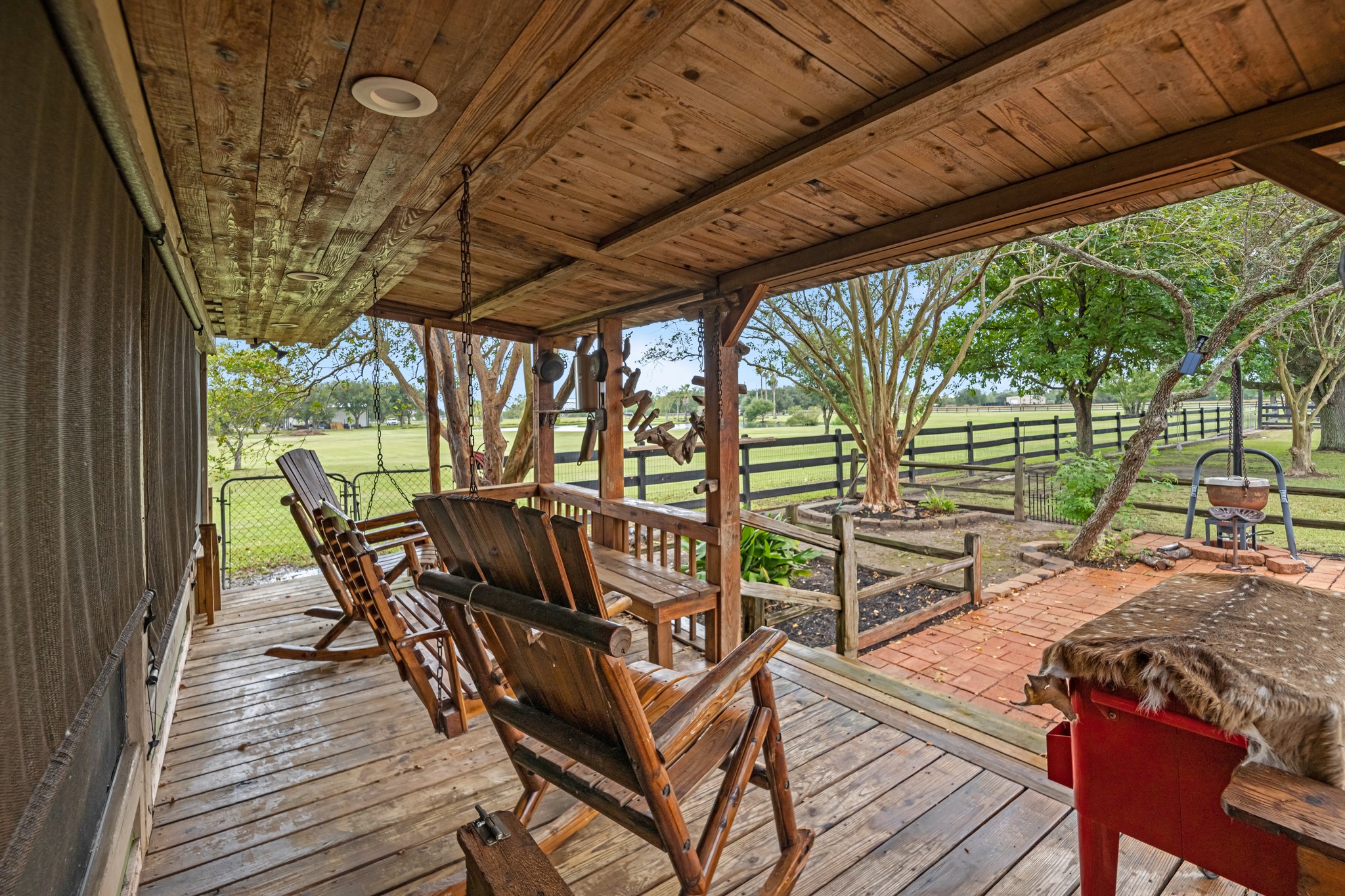 24849 County Road 48 Angleton, TX 77515 - Photo 41 of 48 a view of a chairs and table in patio with wooden floor