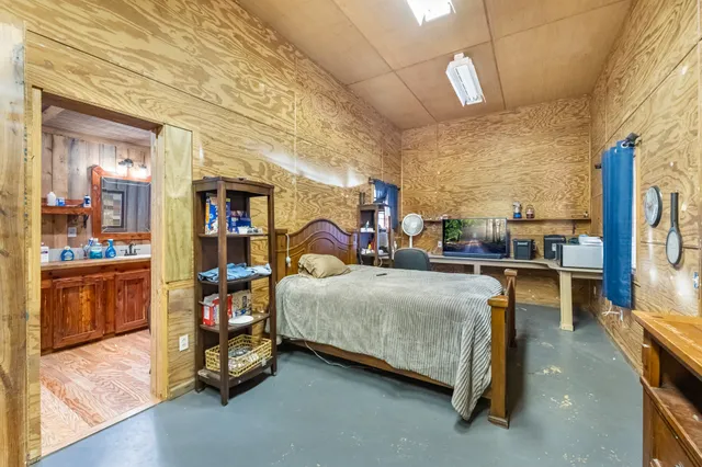 a bedroom with a bed and cabinets