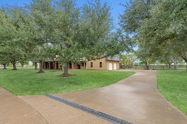 a view of house with a yard