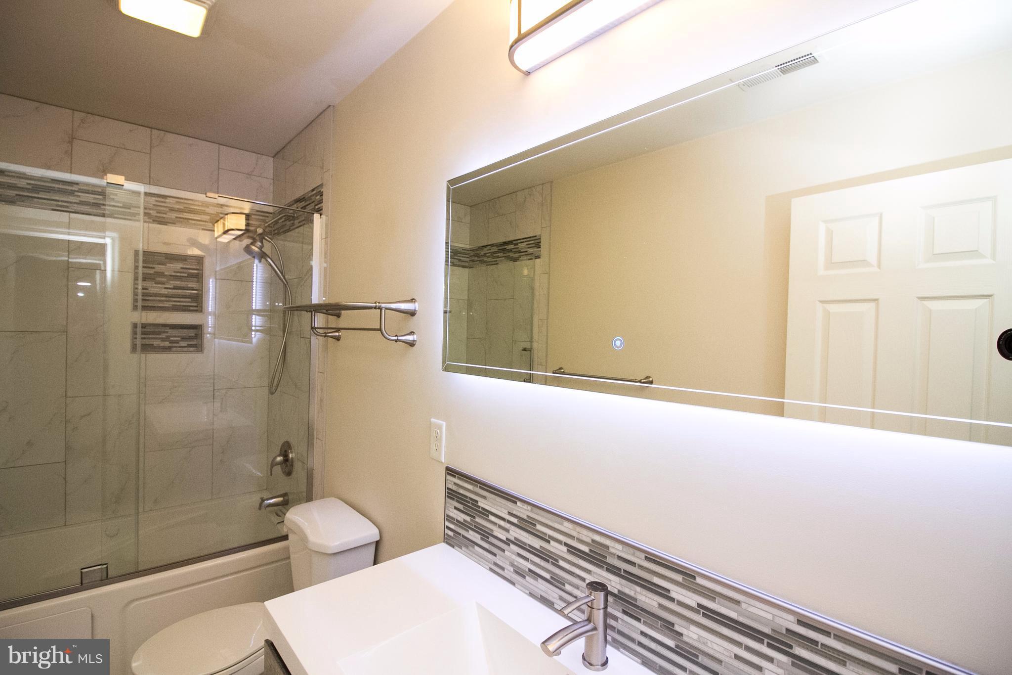 304 East 5th Avenue Ranson, WV 25438 - Photo 12 of 23 Tile floors, tile shower/jetted tub w/ glass doors