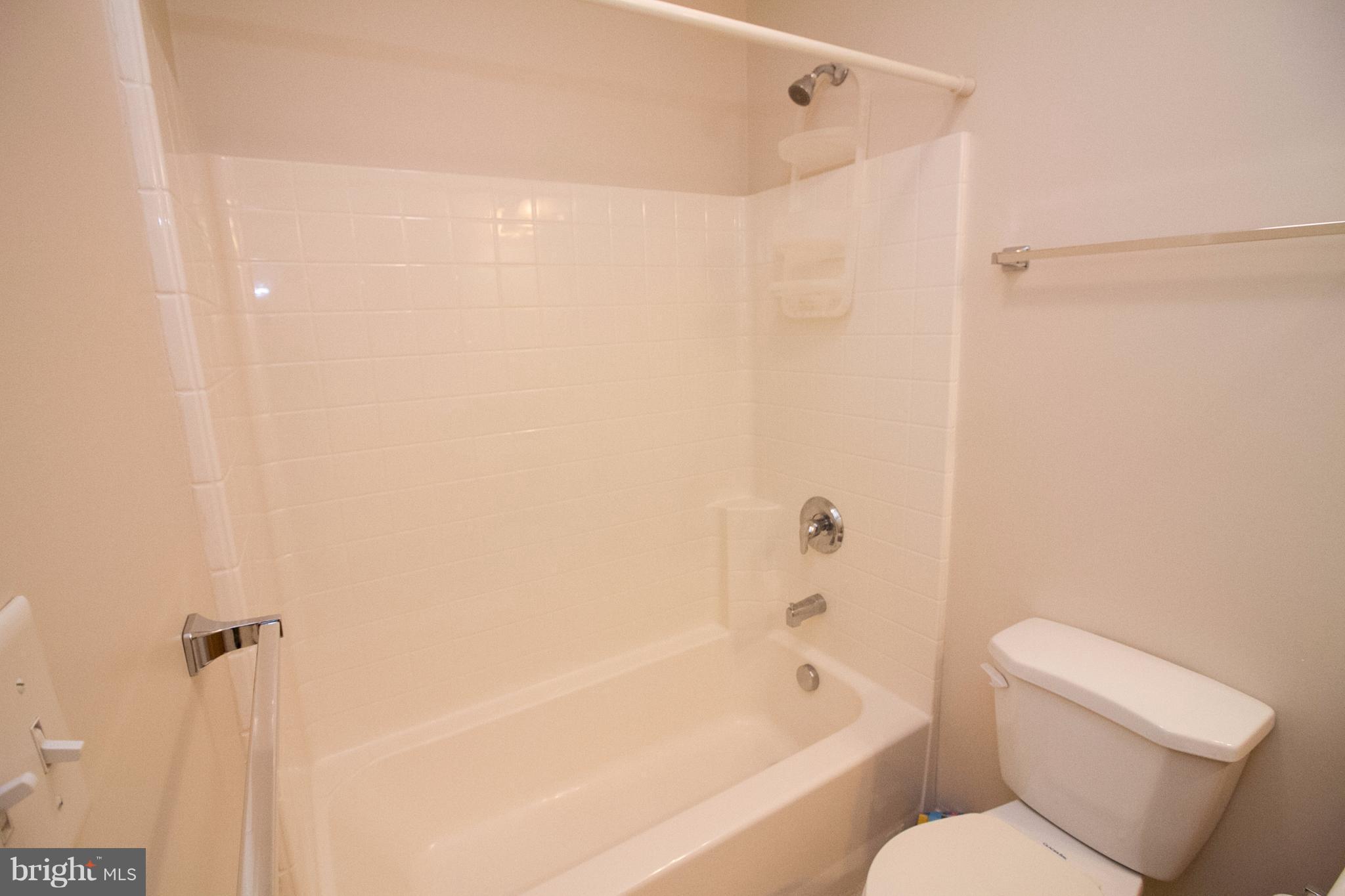 304 East 5th Avenue Ranson, WV 25438 - Photo 22 of 23 Third floor hall bath with tile floor