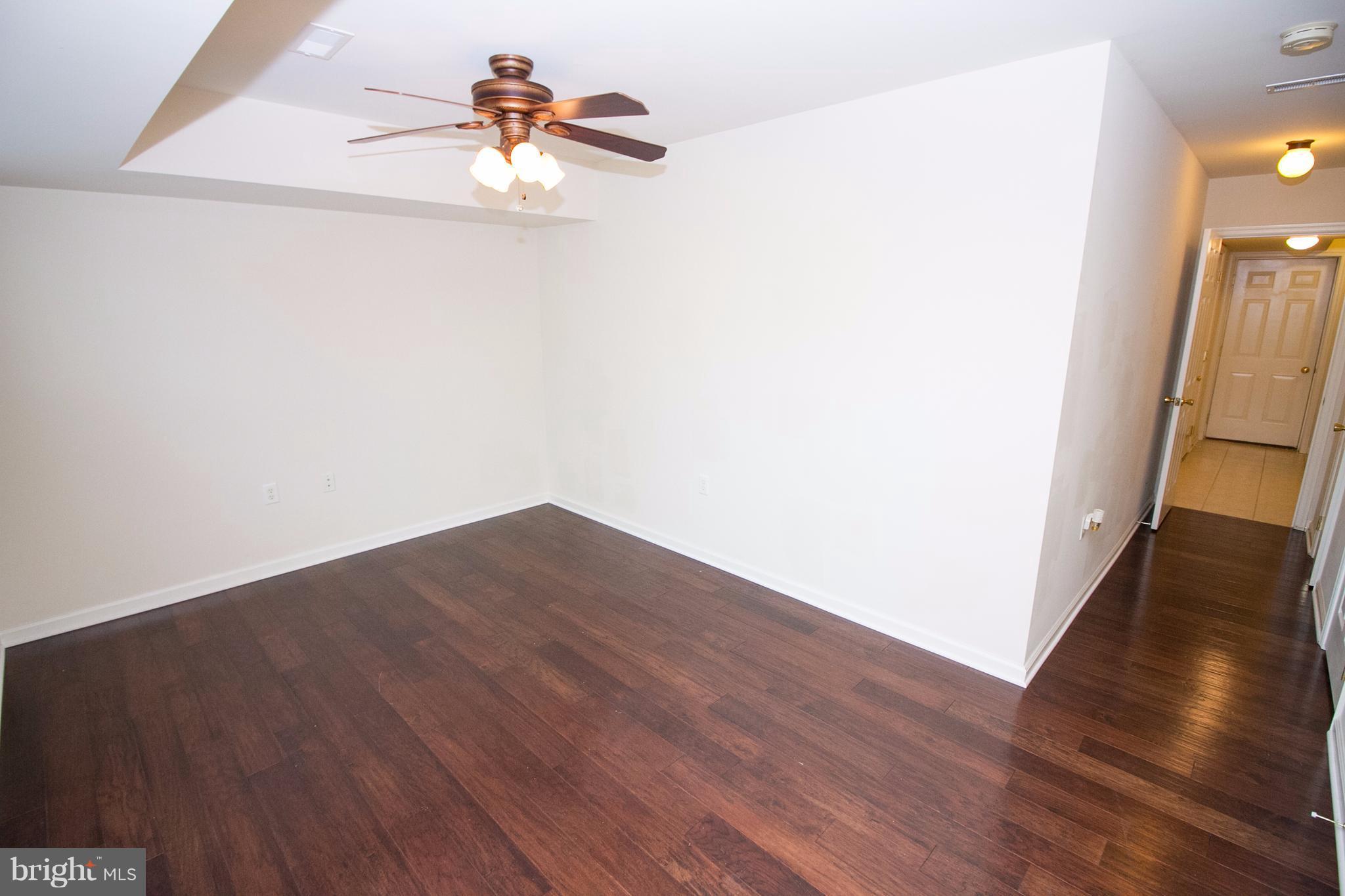 304 East 5th Avenue Ranson, WV 25438 - Photo 8 of 23 First floor rec room with half bathroom
