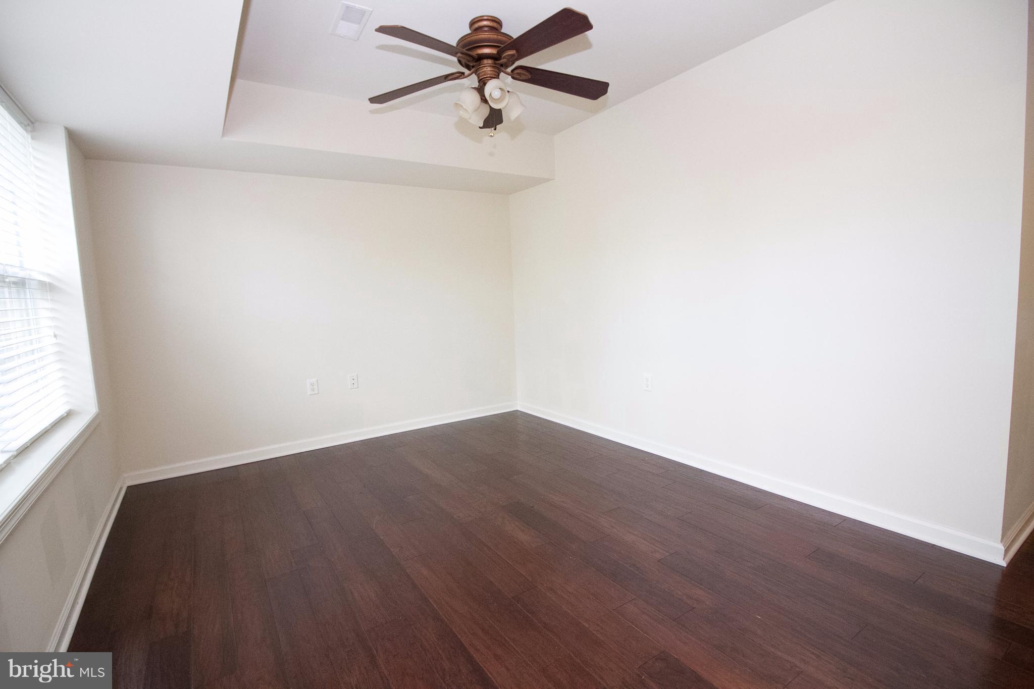 304 East 5th Avenue Ranson, WV 25438 - Photo 9 of 23 Rec room has hardwood & tile in laundry room