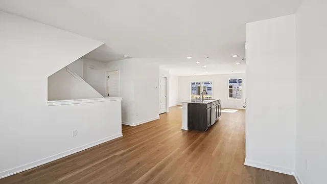 a view of kitchen with furniture and wooden floor