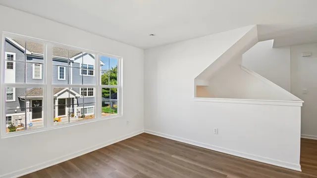 a view of an entryway with wooden floor