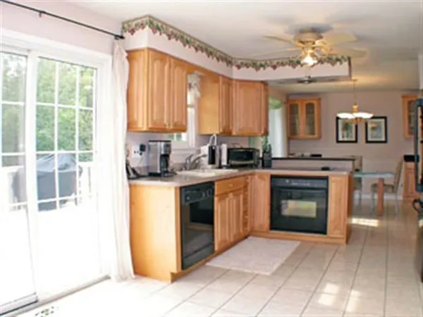 a kitchen with a stove a sink and a refrigerator