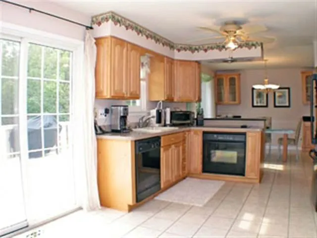 a kitchen with a stove a sink and a refrigerator
