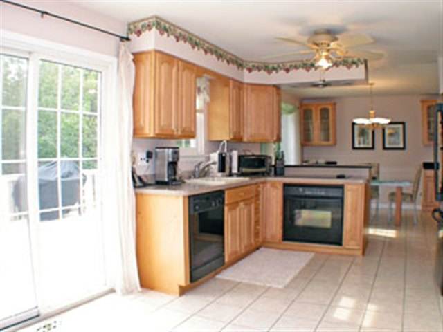 36 Pheasant Drive Sicklerville, NJ 08081 - Photo 6 of 9 a kitchen with a stove a sink and a refrigerator