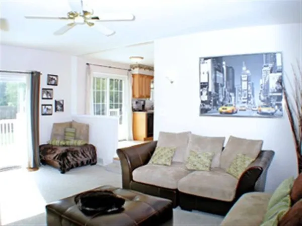 a living room with furniture and a large window