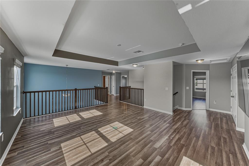 7628 Surf Reed Way Wesley Chapel, FL 33545 - Photo 28 of 76 a view of entryway with wooden floor