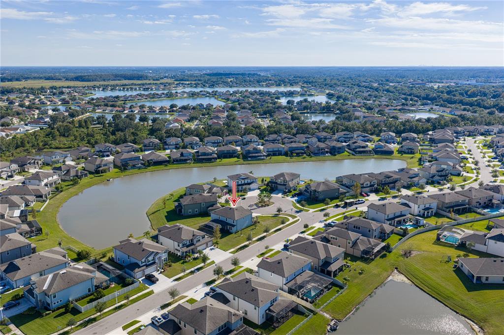 7628 Surf Reed Way Wesley Chapel, FL 33545 - Photo 3 of 76 a view of a city and lake view