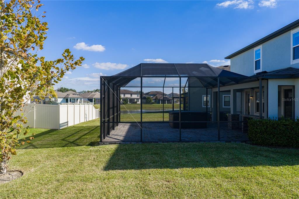 7628 Surf Reed Way Wesley Chapel, FL 33545 - Photo 57 of 76 a view of house with a big yard