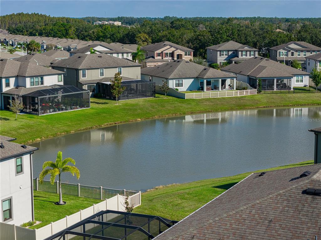 7628 Surf Reed Way Wesley Chapel, FL 33545 - Photo 58 of 76 a aerial view of a house with swimming pool and outdoor space