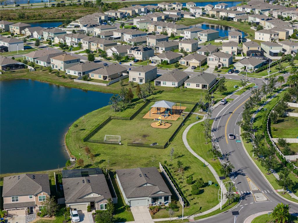 7628 Surf Reed Way Wesley Chapel, FL 33545 - Photo 59 of 76 an aerial view of a house with a swimming pool