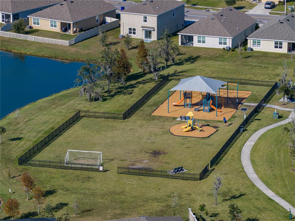 7628 Surf Reed Way Wesley Chapel, FL 33545 - Photo 60 of 76 an aerial view of a house with swimming pool