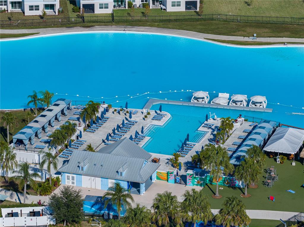 7628 Surf Reed Way Wesley Chapel, FL 33545 - Photo 65 of 76 an aerial view of a house with a swimming pool yard and outdoor seating