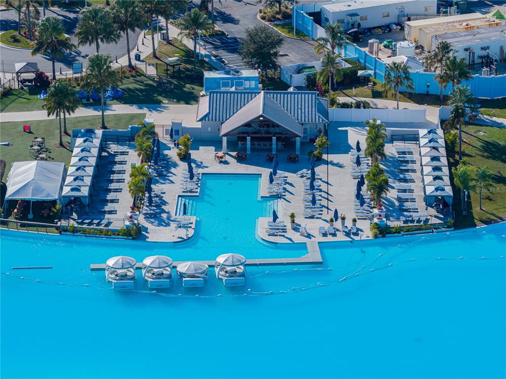 7628 Surf Reed Way Wesley Chapel, FL 33545 - Photo 72 of 76 an aerial view of a yard with table and chairs