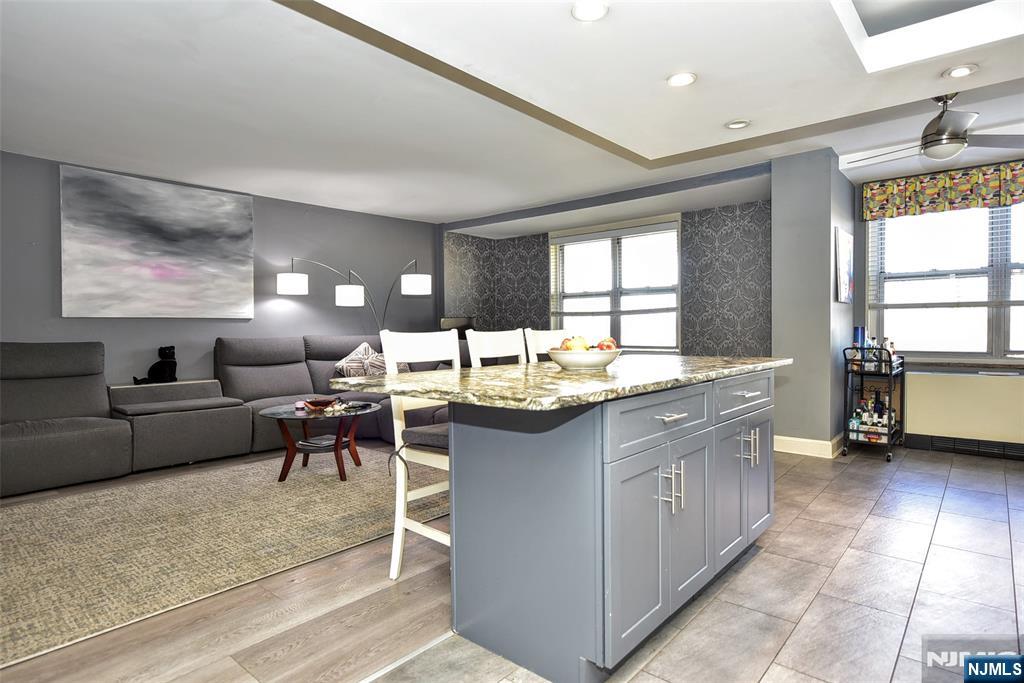 301 Beech Street, Unit 2F Hackensack, NJ 07601 - Photo 11 of 21 a living room with granite countertop furniture and a kitchen