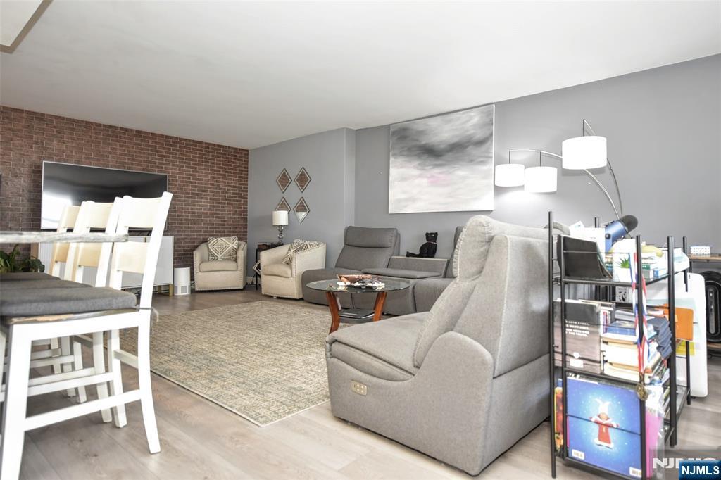 301 Beech Street, Unit 2F Hackensack, NJ 07601 - Photo 13 of 21 a living room with furniture and a flat screen tv