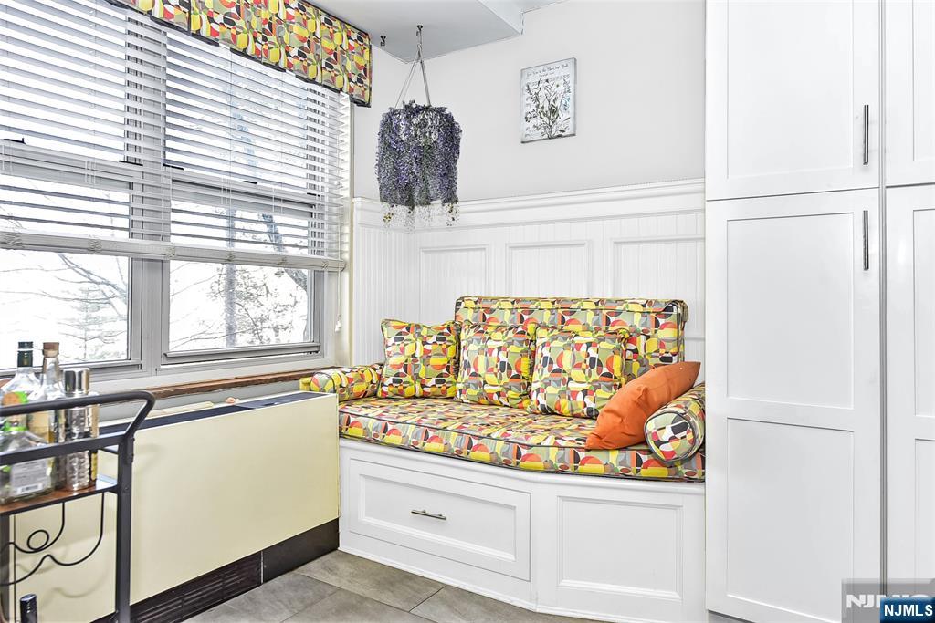 301 Beech Street, Unit 2F Hackensack, NJ 07601 - Photo 8 of 21 a living room with furniture and a large window