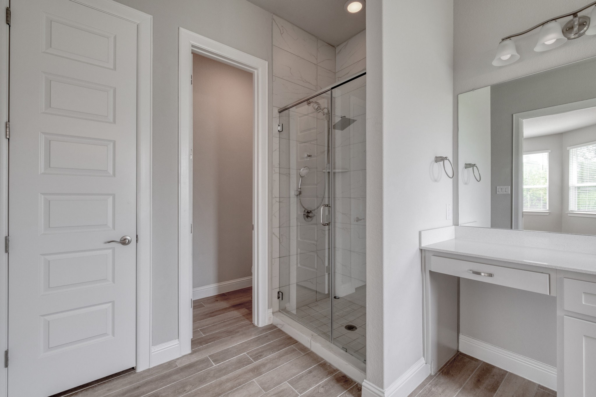 359 Raptor Beak Way Cedar Creek, TX 78612 - Photo 19 of 29 The ensuite bathroom features a large walk-in shower, providing a dedicated space to refresh and start your day