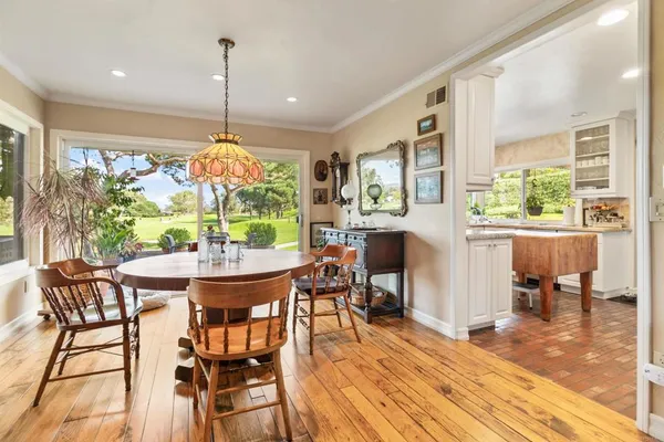 a large kitchen with stainless steel appliances granite countertop a stove and a sink