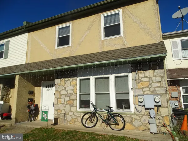 a front view of a house with large windows