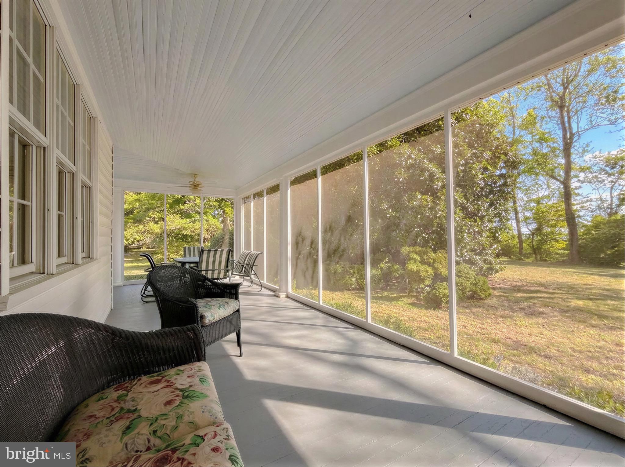 2790 Spout Lane Lusby, MD 20657 - Photo 22 of 95 a living room with furniture and a floor to ceiling window