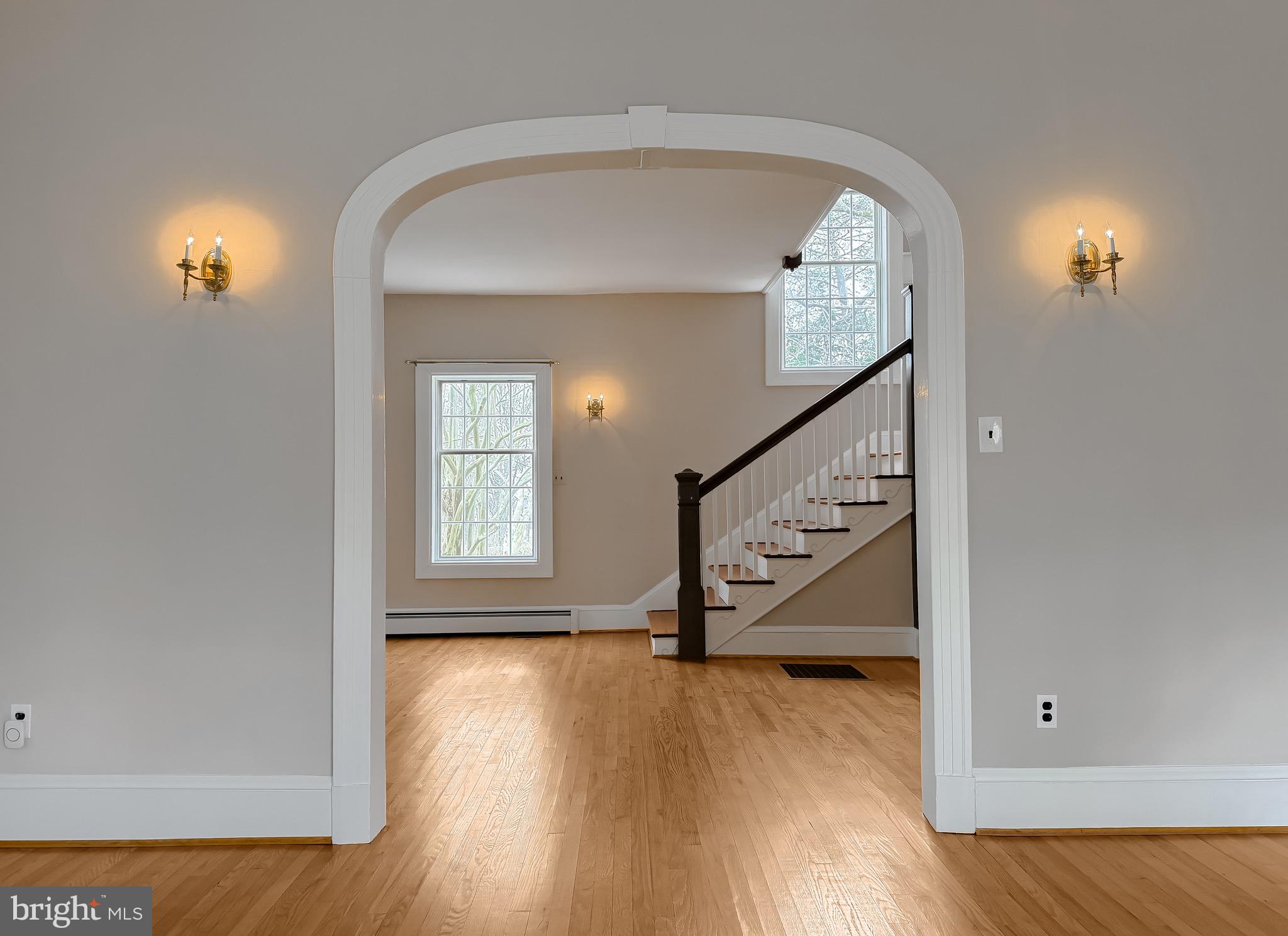 2790 Spout Lane Lusby, MD 20657 - Photo 25 of 95 wooden floor in an entryway with a window and wooden floor