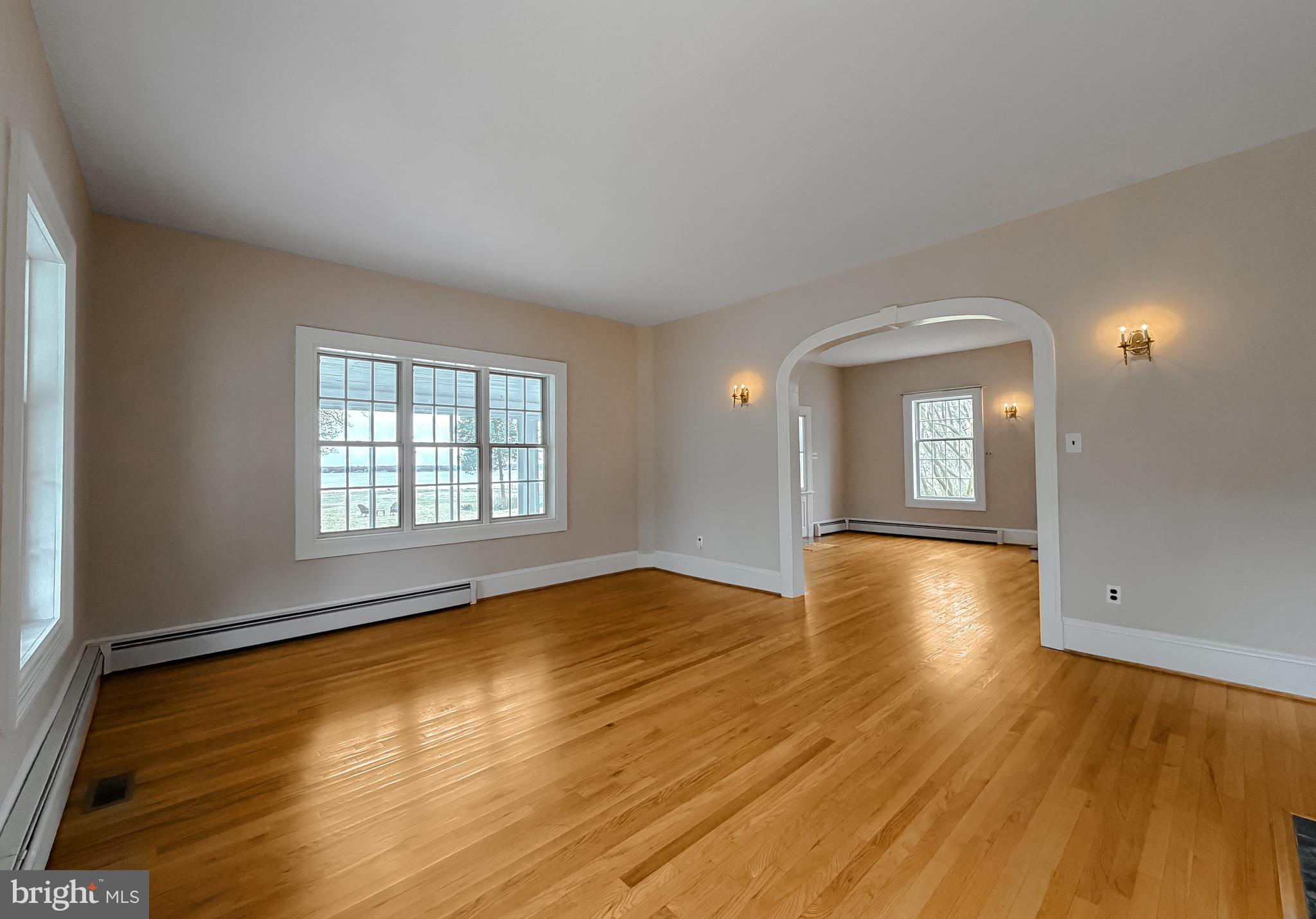2790 Spout Lane Lusby, MD 20657 - Photo 27 of 95 an empty room with wooden floor and windows